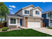 Charming two-story home with a well-manicured lawn and attached two-car garage, perfect for suburban living at 5238 S Jericho Way, Centennial, CO 80015