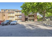 A charming multi-story condo complex features balconies, well-maintained landscaping, and convenient parking at 12368 W Nevada Pl # 206, Lakewood, CO 80228
