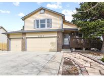 Charming two-story home with a three car garage and manicured front yard at 2957 W Rowland Ave, Littleton, CO 80120