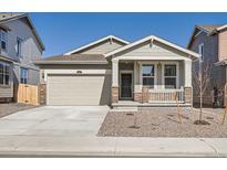 Charming single-Gathering home featuring stone accents, an attached garage, and a well-manicured front yard at 917 W Beverly St, Elizabeth, CO 80107