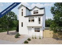 New construction two-story home featuring white siding, a small porch, and a xeriscaped front yard at 46537 Avery Ln, Bennett, CO 80102