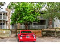 Multi-level condo with stone accents, mature landscaping, and ample parking at 910 S Walden St # 106, Aurora, CO 80017