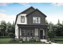 Charming two-story home with a covered front porch and manicured landscaping surrounded by mature trees at 725 Cottonwood Ave, Bennett, CO 80102