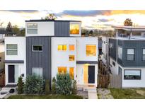 Stunning modern home with sleek architectural details, neutral colors, and professionally landscaped front yard at 2685 S Acoma St, Denver, CO 80223