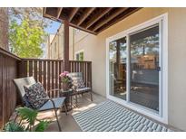 Cozy patio featuring outdoor seating, a stylish rug, and sliding glass door access at 9700 E Iliff Ave # A3, Denver, CO 80231