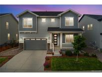 Charming two-story home with a well-manicured lawn and welcoming front porch at 52 Simmental Loop, Castle Rock, CO 80104