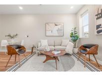 Inviting living room featuring modern furnishings, stylish decor, and natural light, perfect for relaxation and entertaining at 1071 Oak Cir, Lakewood, CO 80215