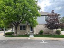 Charming two-story townhome with a well-maintained lawn and a welcoming front entrance at 1385 W 112Th Ave # D, Denver, CO 80234