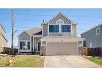 Charming two-story home featuring a two-car garage, stone accents, and well-maintained landscaping at 618 S Carlton St, Castle Rock, CO 80104