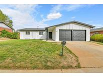 Charming single-story home featuring a two-car garage and well-maintained front lawn at 5224 Scranton Ct, Denver, CO 80239