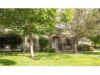 Charming home featuring a well-maintained lawn and mature trees in a peaceful neighborhood at 12790 Jackson St, Thornton, CO 80241