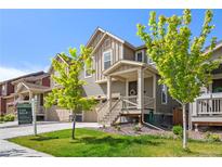 Charming exterior view of a two-story home with well-maintained lawn and landscaping at 723 176Th Ave, Broomfield, CO 80023