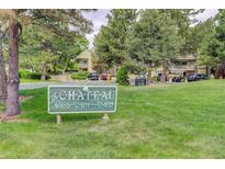 The Chateau community sign in front of lush landscaping and residential buildings at 4605 S Yosemite St # 301, Denver, CO 80237