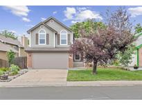 Charming two-story home with a two-car garage, brick accents, and a well-manicured front lawn at 12193 Deerfield Way, Broomfield, CO 80020