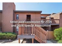 Two-story condo featuring a private entrance and stairway leading to the upper level at 540 S Forest St # 3-204, Denver, CO 80246