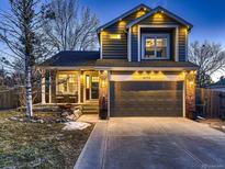 Charming two-story home featuring a covered front porch and two car garage at 19772 Centerville Ct, Parker, CO 80134