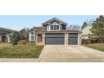 Charming home with a well-manicured lawn, and a three-car garage at 16442 Bluebonnet Dr, Parker, CO 80134