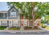 Charming townhomes with colorful facades and well-maintained landscaping in a desirable neighborhood at 1068 Milo Cir # A, Lafayette, CO 80026