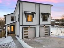 Modern two-unit building with attached garages and snow-covered driveway at 4660 W 9Th Ave, Denver, CO 80204