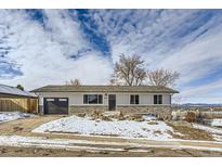 Ranch style home with stone accents and a two-car garage at 4501 S Lipan Ct, Englewood, CO 80110