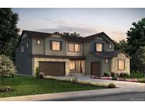 Charming two-story home featuring a stone-accented facade, a two-car garage, and professional landscaping at 8484 Orchard City Dr, Littleton, CO 80125