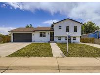 Charming two-story home with a well-maintained front yard, driveway, and inviting curb appeal at 2830 E 99Th Way, Thornton, CO 80229