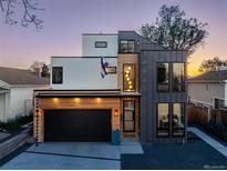 Contemporary home showcasing a striking facade with mixed materials and modern architectural design at 1655 Wolff St, Denver, CO 80204
