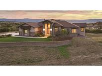 Stunning ranch home with mountain views and landscaped yard at 1701 Creedmoor Ct, Castle Rock, CO 80109