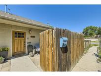 Charming front yard with a wooden fence, inviting entrance and a glimpse of neighborhood charm at 2841 N Columbine St, Denver, CO 80205