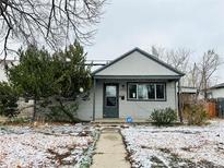 Charming single Gathering home with gray siding, landscaped front yard, and inviting walkway at 1170 Elmira St, Aurora, CO 80010