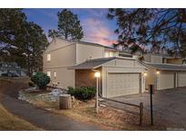 Charming townhome featuring an attached garage and well-maintained landscaping at 2754 S Kenton Ct, Aurora, CO 80014