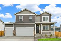 Charming two-story home featuring a two car garage and inviting front porch at 4331 Gypsum Ave, Mead, CO 80504