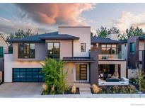 Stunning two-story home with modern design and landscaped yard at 7036 E Archer Pl, Denver, CO 80230