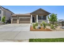 Charming single-Gathering home with a landscaped front yard and a welcoming front porch at 171 S Waterloo St, Aurora, CO 80018