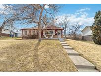 Charming single-story home with a landscaped front yard and inviting entryway at 3550 Kassler Pl, Westminster, CO 80031