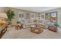 Spacious living room featuring comfortable seating, stylish decor, and ample natural light at 30 Eagle Dr, Littleton, CO 80123