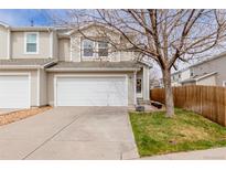 Charming townhouse features a two-car garage, and a well-manicured lawn in a desirable community at 16379 E Otero Pl, Englewood, CO 80112