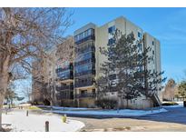 Condo building exterior with landscaping and parking at 13601 E Marina Dr # 404, Aurora, CO 80014