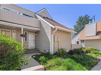 Inviting home exterior featuring tidy landscaping and a covered porch area at 2491 S Xanadu Way # A, Aurora, CO 80014