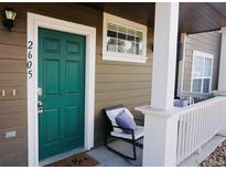 Charming front door with a welcoming exterior and seating area at 14700 E 104Th Ave # 2605, Commerce City, CO 80022