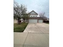 Charming two-story home with a three car garage and stone accents at 19193 E Amherst Dr, Aurora, CO 80013