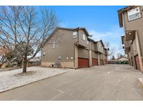 A nice view of multiple townhomes, each with private garages and appealing architecture at 6450 W 44Th Pl # B-3, Wheat Ridge, CO 80033