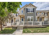 Charming townhome with a fenced front yard, well-manicured lawn, and inviting entrance at 1539 Bennet Mountain Rd, Castle Rock, CO 80109