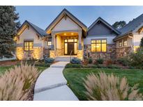 Stunning two-story home with stone accents and manicured landscaping at 6 Driver Ln, Littleton, CO 80123