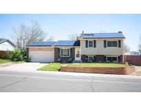 Charming two-story home with solar panels, well-maintained lawn and brick accents at 4360 S Braun Ct, Morrison, CO 80465