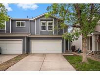 Charming two-story home with a large two car garage and driveway at 814 Pintail Ave, Brighton, CO 80601