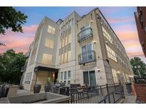 Beautiful modern building exterior with black metal balconies and gorgeous sunset sky at 340 S Lafayette St # 204, Denver, CO 80209