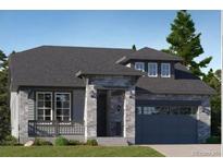 Charming single-story home with a stone facade, covered porch, and a two-car garage, exuding curb appeal at 576 Nightsky St, Erie, CO 80516