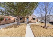 Inviting single-story home with a well-maintained front yard and classic design at 430 Osceola St, Denver, CO 80204