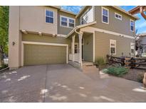 Inviting two-story home with a two-car garage and a charming front porch at 6145 S Paris St, Greenwood Village, CO 80111